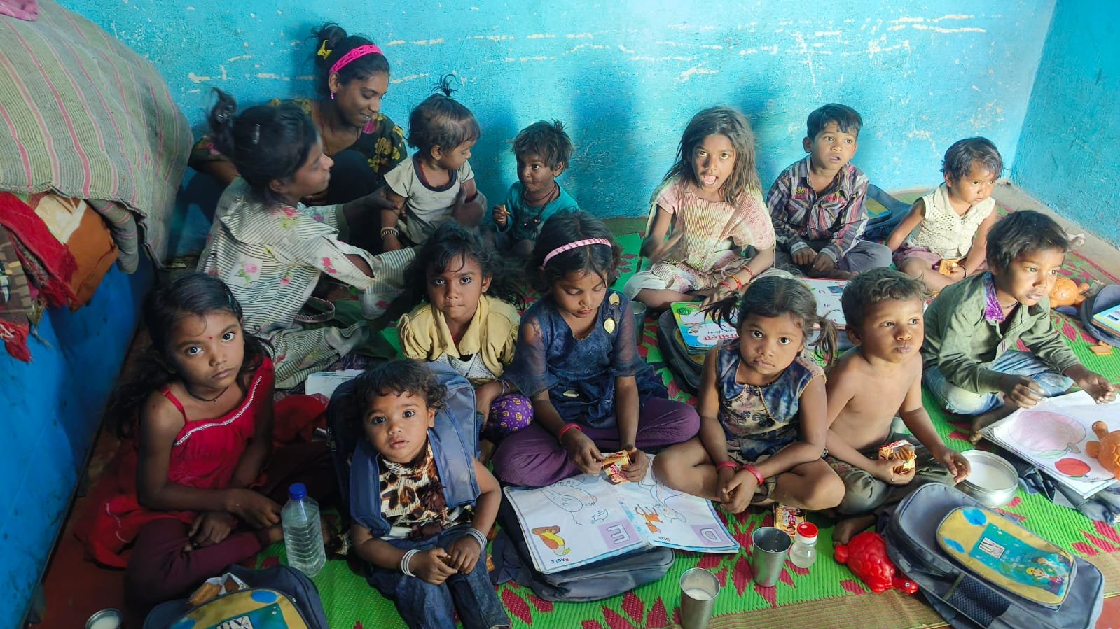Women and children learning together at a community centre