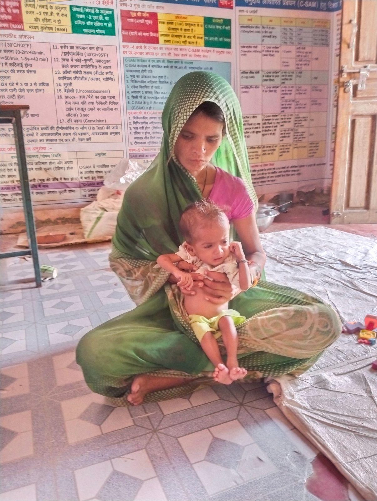 A mother with her infant at a nutrition and health centre