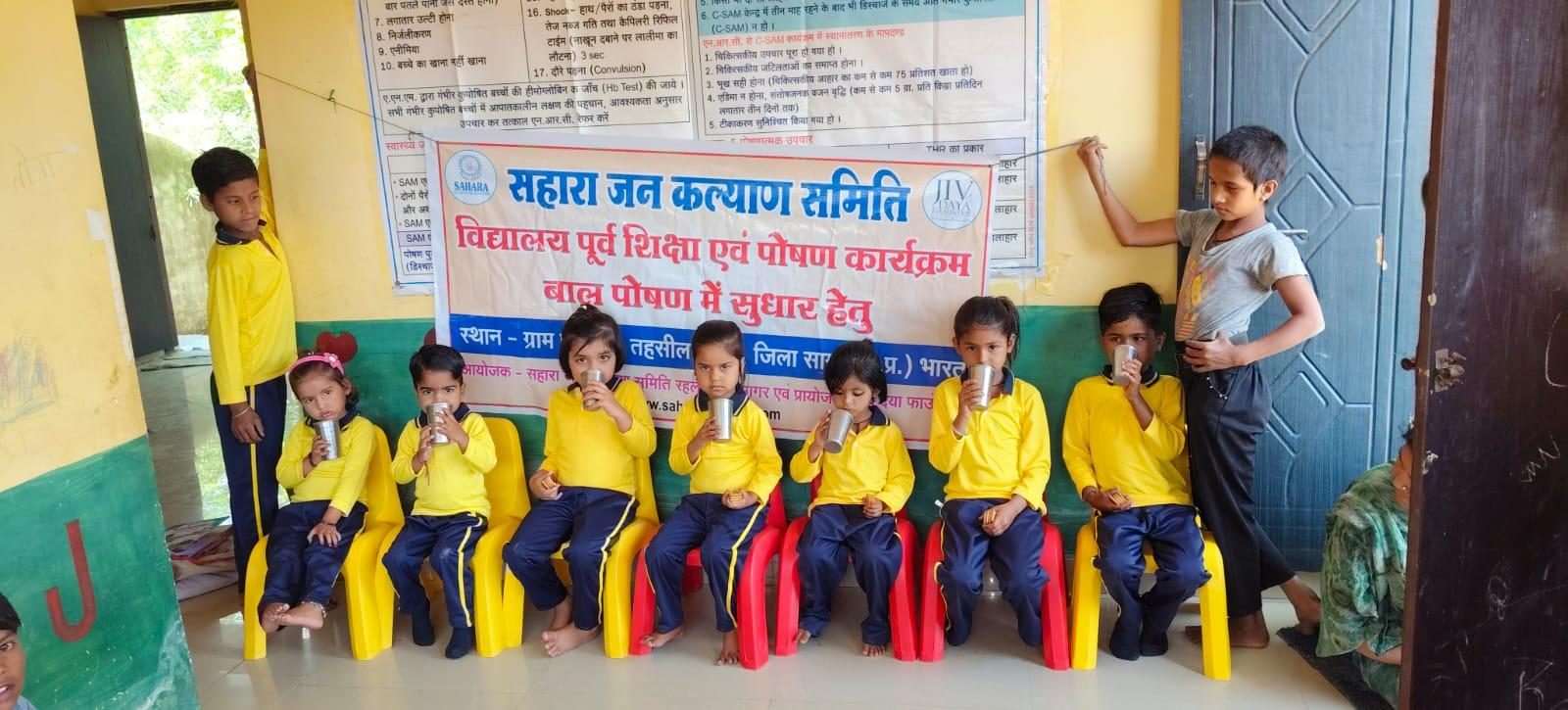 Pre-school children in yellow uniforms at a Sahara education and nutrition centre