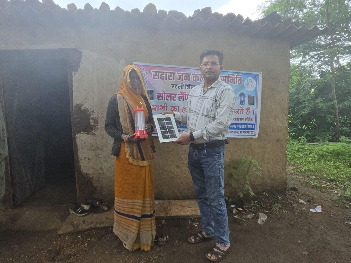 In a Rahli-block settlement that has never had an electricity connection, an elderly resident received a solar lantern and panel.